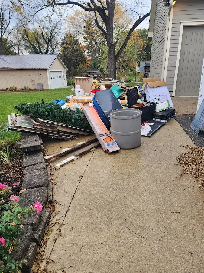 Dumpster being loaded with debris for 3 Yard Dumpster Rental in Mechanicville